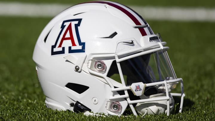 Nov 25, 2022; Tucson, Arizona, USA; Detailed view of an Arizona Wildcats helmet on the field during the Territorial Cup at Arizona Stadium. Mandatory Credit: Mark J. Rebilas-Imagn Images Nov 25, 2022; Tucson, Arizona, USA; Detailed view of an Arizona Wildcats helmet on the field during the Territorial Cup at Arizona Stadium. Mandatory Credit: Mark J. Rebilas-Imagn Images