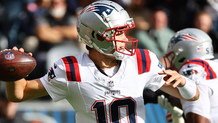 Nov 10, 2024; Chicago, Illinois, USA; New England Patriots quarterback Drake Maye (10) drops back to pass against the Chicago Bears during the first quarter at Soldier Field. Mandatory Credit: Mike Dinovo-Imagn Images Nov 10, 2024; Chicago, Illinois, USA; New England Patriots quarterback Drake Maye (10) drops back to pass against the Chicago Bears during the first quarter at Soldier Field. Mandatory Credit: Mike Dinovo-Imagn Images
