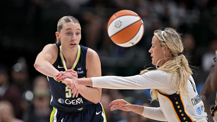 Aug 1, 2025; Dallas, Texas, USA; Dallas Wings guard Paige Bueckers (5) and Indiana Fever guard Sophie Cunningham (8) in action during the game between the Dallas Wings and the Indiana Fever at the American Airlines Center. Mandatory Credit: Jerome Miron-Imagn Images