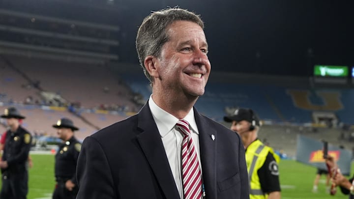 Indiana Hoosiers athletic director Scott Dolson (left) celebrates a win over the UCLA Bruins at the Rose Bowl during the 2024 football season.
