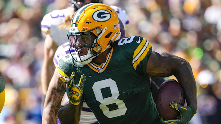 Sep 29, 2024; Green Bay, Wisconsin, USA;  Green Bay Packers running back Josh Jacobs (8) rushes with the football during the first quarter against the Minnesota Vikings at Lambeau Field. Mandatory Credit: Jeff Hanisch-Imagn Images