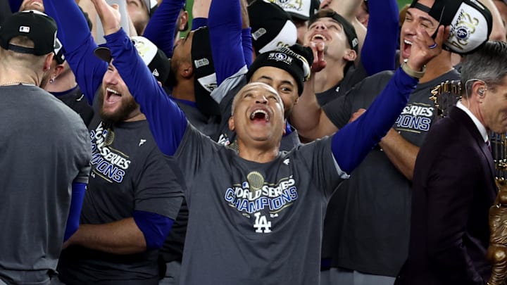ttttttOct 30, 2024; New York, New York, USA; Los Angeles Dodgers manager Dave Roberts (30) celebrates with players and staff after winning the 2024 MLB World Series against the New York Yankees at Yankee Stadium. Mandatory Credit: Wendell Cruz-Imagn Images