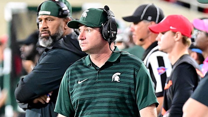 Sep 28, 2024; East Lansing, Michigan, USA; Michigan State Spartans head coach Jonathan Smith watches from the sidelines as the Ohio State Buckeyes defeat his team at Spartan Stadium. Mandatory Credit: Dale Young-Imagn Images