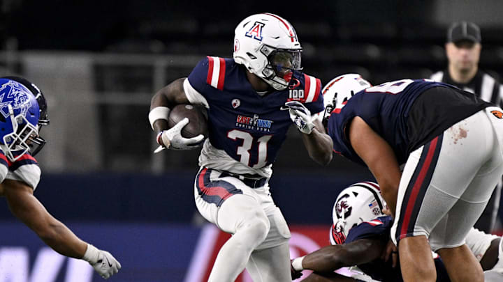 Jan 30, 2025; Arlington, TX, USA; East running back Jacory Croskey-Merritt of Arizona (31) runs with the ball against the West during the second half at AT&T Stadium. Jan 30, 2025; Arlington, TX, USA; East running back Jacory Croskey-Merritt of Arizona (31) runs with the ball against the West during the second half at AT&T Stadium.