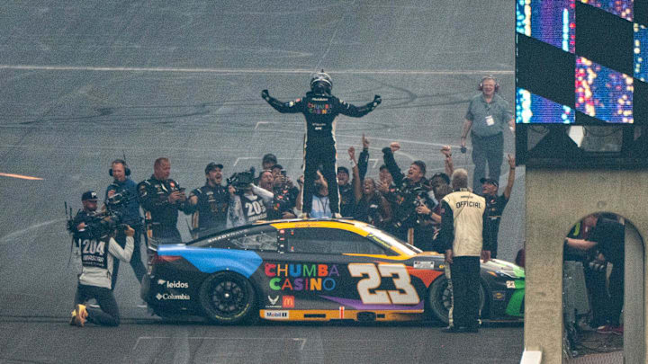 NASCAR Cup Series driver Bubba Wallace (23) celebrates with his crew after winning Sunday, July 27, 2025, during the Brickyard 400 at Indianapolis Motor Speedway.