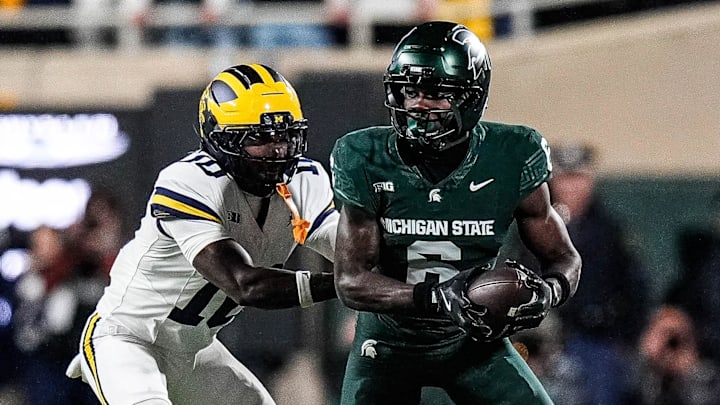 Michigan defensive back Zeke Berry (10) tackles Michigan State wide receiver Nick Marsh (6) during the first half at Spartan Stadium in East Lansing on Saturday, October 25, 2025.