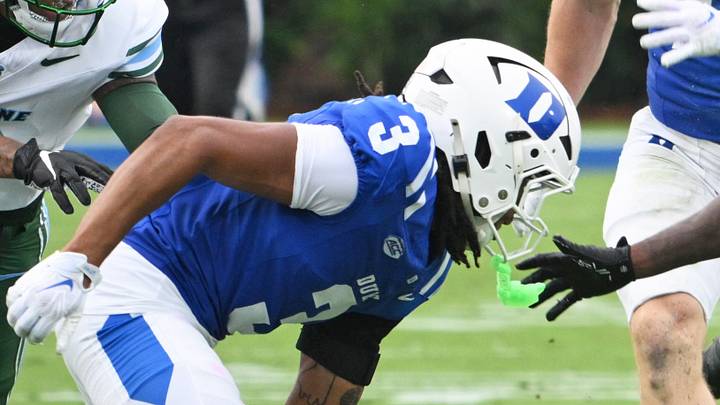 Sep 5, 2026; Durham, North Carolina, USA;  Tulane Green Wave cornerback Shaun Nicholas (0) runs the ball against Duke Blue Devils cornerback Landan Callahan (3) during the second quarter at Wallace Wade Stadium.  Mandatory Credit: Zachary Taft-Imagn Images