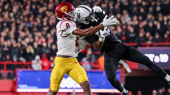 Nebraska defensive back Andrew Marshall grabs an interception in front of USC wideout Ja'Kobi Lane last season.