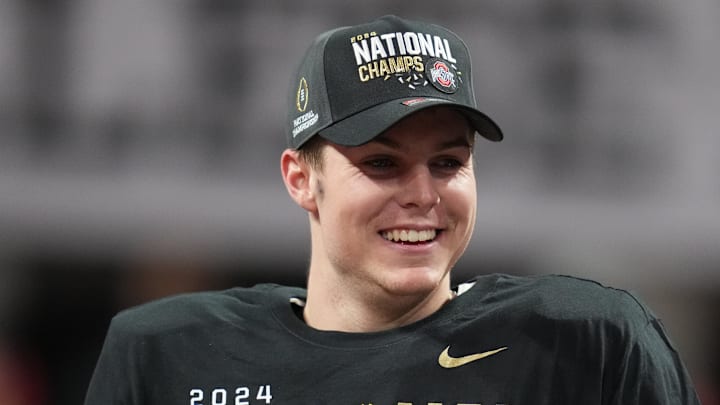 Jan 20, 2025; Atlanta, GA, USA; Ohio State Buckeyes quarterback Will Howard (18) on the podium after defeating the Notre Dame Fighting Irish in the CFP National Championship college football game at Mercedes-Benz Stadium. Jan 20, 2025; Atlanta, GA, USA; Ohio State Buckeyes quarterback Will Howard (18) on the podium after defeating the Notre Dame Fighting Irish in the CFP National Championship college football game at Mercedes-Benz Stadium.