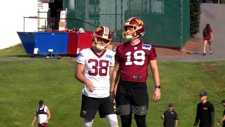 Washington Commanders kicker Drew Stevens walks alongside holder Matt Haack after converting a field goal during Tuesday’s training camp practice in Ashburn, Virginia. Washington Commanders kicker Drew Stevens walks alongside holder Matt Haack after converting a field goal during Tuesday’s training camp practice in Ashburn, Virginia.
