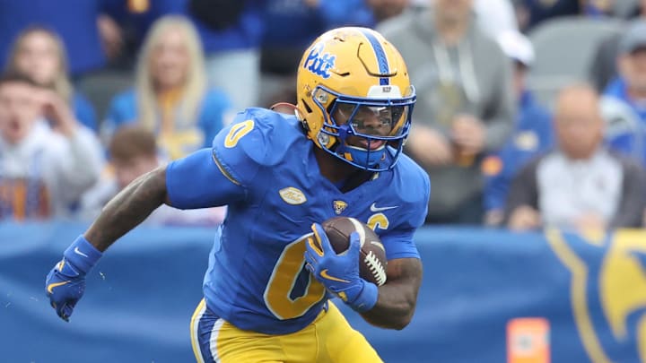 Nov 15, 2025; Pittsburgh, Pennsylvania, USA;  Pittsburgh Panthers running back Desmond Reid (0) runs after catch against the Notre Dame Fighting Irish during the first quarter at Acrisure Stadium. Mandatory Credit: Charles LeClaire-Imagn Images