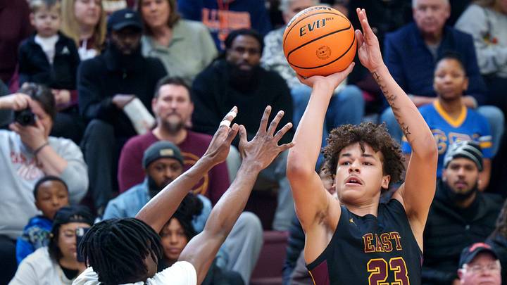East Peoria’s Quinton Kitt (23) shoots over Peoria High’s Jacob Duffin Jr. in the first half of their high school basketball game Saturday, Jan. 3, 2026 at Peoria High School. The Lions defeated the Raiders 65-61. East Peoria’s Quinton Kitt (23) shoots over Peoria High’s Jacob Duffin Jr. in the first half of their high school basketball game Saturday, Jan. 3, 2026 at Peoria High School. The Lions defeated the Raiders 65-61.