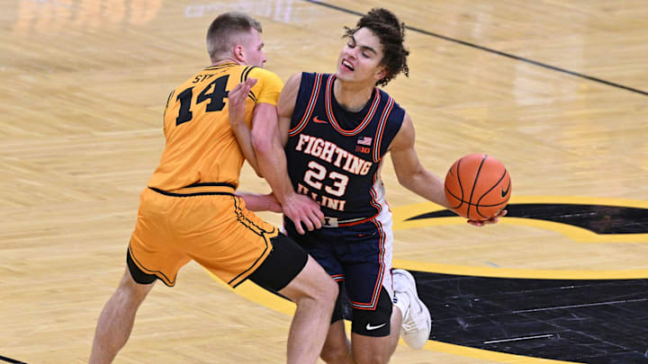 Jan 11, 2026; Iowa City, Iowa, USA; Illinois Fighting Illini guard Keaton Wagler (23) collides with Iowa Hawkeyes guard Bennett Stirtz (14) during the first half at Carver-Hawkeye Arena. Mandatory Credit: Jeffrey Becker-Imagn Images Jan 11, 2026; Iowa City, Iowa, USA; Illinois Fighting Illini guard Keaton Wagler (23) collides with Iowa Hawkeyes guard Bennett Stirtz (14) during the first half at Carver-Hawkeye Arena. Mandatory Credit: Jeffrey Becker-Imagn Images