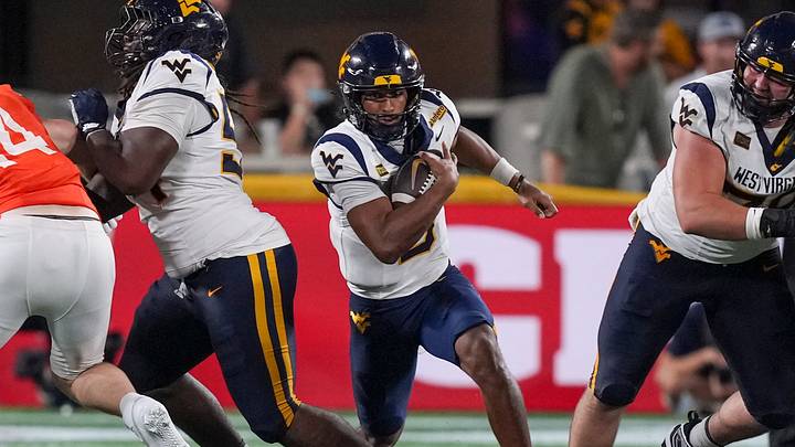 Sep 19, 2026; Charlotte, North Carolina, USA; West Virginia Mountaineers quarterback Michael Hawkins Jr. (3) scrambles for a run out of the pocket during the second half against the Virginia Cavaliers at Bank of America Stadium. Sep 19, 2026; Charlotte, North Carolina, USA; West Virginia Mountaineers quarterback Michael Hawkins Jr. (3) scrambles for a run out of the pocket during the second half against the Virginia Cavaliers at Bank of America Stadium.
