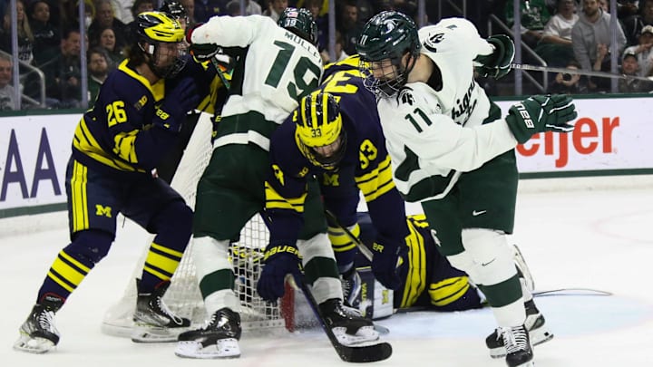 A pileup of Spartans and Wolverines at the net, Saturday, March 23, 2024, during the Big Ten Hockey final at Munn Ice Arena in East Lansing. MSU won 5-4 in overtime. A pileup of Spartans and Wolverines at the net, Saturday, March 23, 2024, during the Big Ten Hockey final at Munn Ice Arena in East Lansing. MSU won 5-4 in overtime.