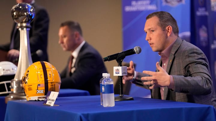 Arizona State head coach Kenny Dillingham responds to a question during a joint news conference with Texas head coach Steve Sarkisian before facing off in the Chick-fil-A Peach Bowl.