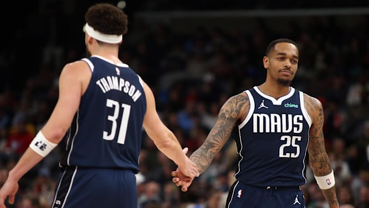 Jan 6, 2025; Memphis, Tennessee, USA; Dallas Mavericks forward P.J. Washington (25) reacts with guard Klay Thompson (31) during the third quarter against the Memphis Grizzlies at FedExForum. Mandatory Credit: Petre Thomas-Imagn Images