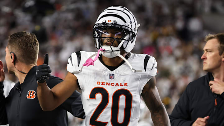 Oct 16, 2025; Cincinnati, Ohio, USA; Cincinnati Bengals cornerback DJ Turner II (20) gestures toward his bench as he walks off the field with an apparent injury against the Pittsburgh Steelers during the third quarter at Paycor Stadium. Mandatory Credit: Joseph Maiorana-Imagn Images
