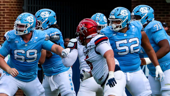 North Carolina offensive linemen Chad Lindbergh (69) and Daniel King (52)