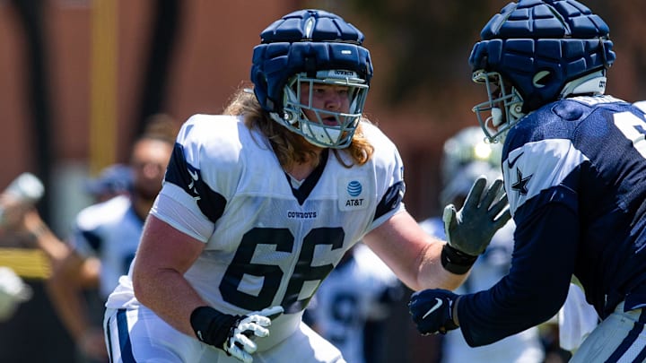 Dallas Cowboys guard T.J. Bass blocks during training camp at Marriott Residence Inn-River Ridge playing fields. 