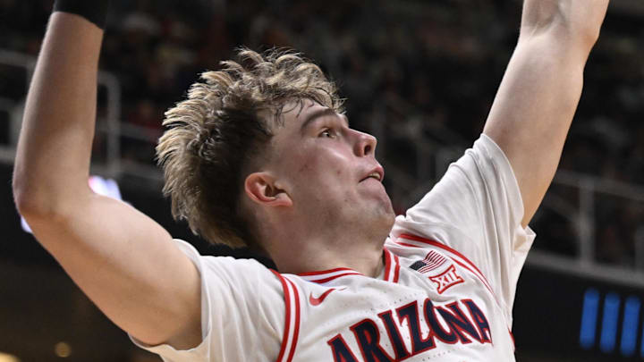 Mar 26, 2026; San Jose, CA, USA; Arkansas Razorbacks guard Darius Acuff Jr. (5) shoots the ball against Arizona Wildcats center Motiejus Krivas (13) in the second half during a Sweet Sixteen game of the West Regional of the men's 2026 NCAA Tournament at SAP Center. Mandatory Credit: Eakin Howard-Imagn Images
