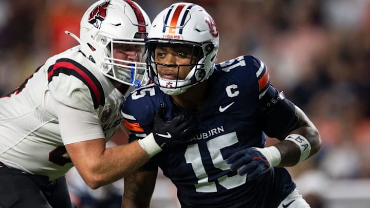 Auburn Tigers defensive end Keldric Faulk (15) blitzes as Auburn Tigers take on Ball State Cardinals at Jordan-Hare Stadium 