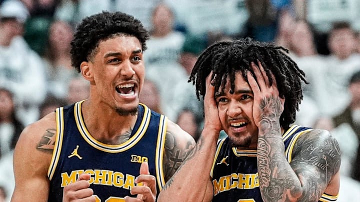 Michigan guard Elliot Cadeau (3) and forward Yaxel Lendeborg (23) celebrate a play against Michigan State during the second half at Breslin Center in East Lansing on Friday, Jan. 30, 2026.