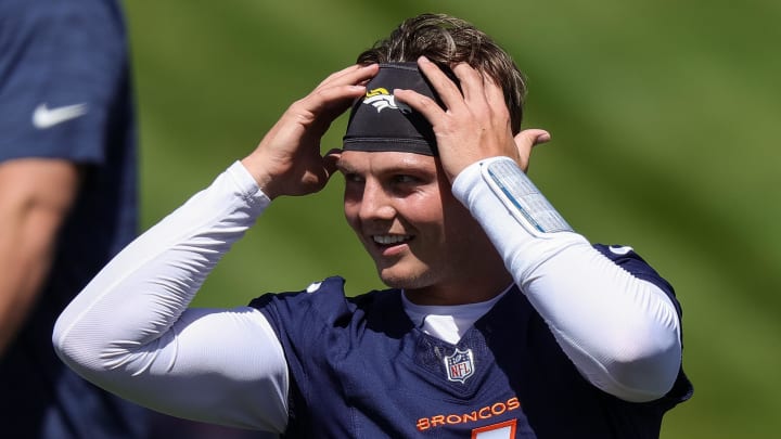 May 23, 2024; Englewood, CO, USA; Denver Broncos quarterback Zach Wilson (4) during organized team activities at Centura Health Training Center. 