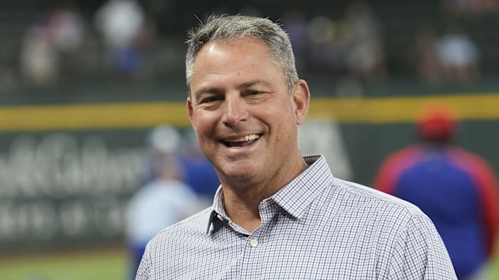 Jun 21, 2024; Arlington, Texas, USA; Texas Rangers general manager Chris Young (left) and Kansas City Royals general manager J.J. Picollo (right) talk before the game against the Kansas City Royals at Globe Life Field. Mandatory Credit: Jim Cowsert-Imagn Images