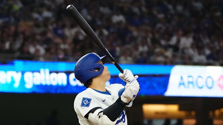 Los Angeles Dodgers designated hitter Shohei Ohtani (17) hits a home run in the fourth inning as Chicago White Sox catcher Kyle Teel (8) and home plate umpire Alan Porter (64) watch at Dodger Stadium on July 1. 