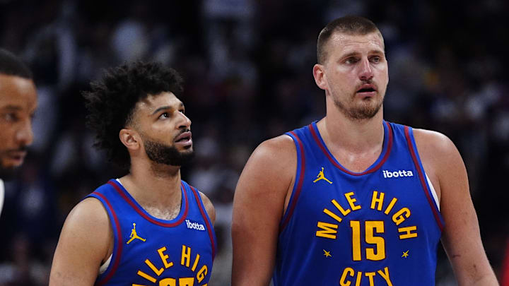 Apr 19, 2025; Denver, Colorado, USA; Denver Nuggets center Nikola Jokic (15) and Denver Nuggets guard Jamal Murray (27) during overtime against the LA Clippers at Ball Arena.