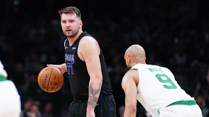 Jun 6, 2024; Boston, Massachusetts, USA; Dallas Mavericks guard Luka Doncic (77) controls the ball against Boston Celtics guard Derrick White (9) in the first quarter during game one of the 2024 NBA Finals at TD Garden. Mandatory Credit: David Butler II-USA TODAY Sports Jun 6, 2024; Boston, Massachusetts, USA; Dallas Mavericks guard Luka Doncic (77) controls the ball against Boston Celtics guard Derrick White (9) in the first quarter during game one of the 2024 NBA Finals at TD Garden. Mandatory Credit: David Butler II-USA TODAY Sports