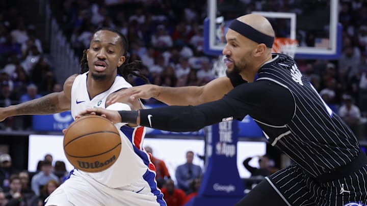 Apr 22, 2026; Detroit, Michigan, USA; Orlando Magic guard Jalen Suggs (4) knocks the ball from Detroit Pistons guard Daniss Jenkins (24) in the second half during game two of the first round of the 2026 NBA Playoffs at Little Caesars Arena. Mandatory Credit: Rick Osentoski-Imagn Images