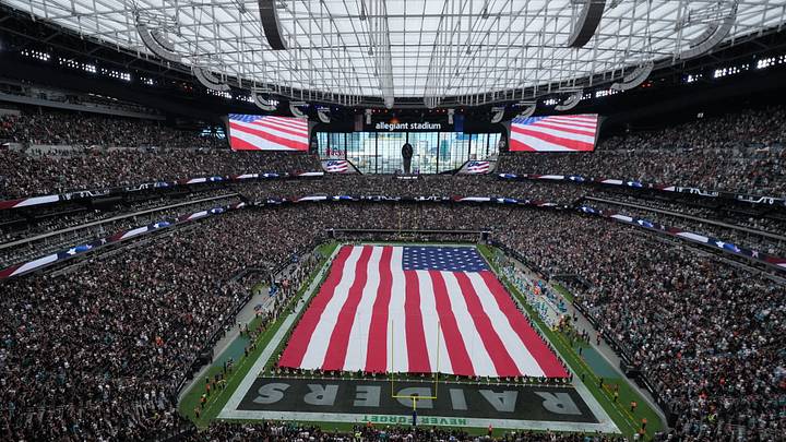 Sep 13, 2026; Paradise, Nevada, USA; A general view of Allegiant Stadium with a United States flag on the field during the national anthem before the game between Miami Dolphins and Las Vegas Raiders. Mandatory Credit: Kirby Lee-Imagn Images Sep 13, 2026; Paradise, Nevada, USA; A general view of Allegiant Stadium with a United States flag on the field during the national anthem before the game between Miami Dolphins and Las Vegas Raiders. Mandatory Credit: Kirby Lee-Imagn Images