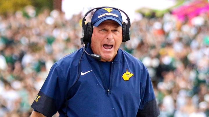Sep 6, 2025; Athens, Ohio, USA; West Virginia Mountaineers head coach Rich Rodriguez calls a timeout during the second quarter against the Ohio Bobcats at Peden Stadium. Mandatory Credit: Ben Queen-Imagn Images