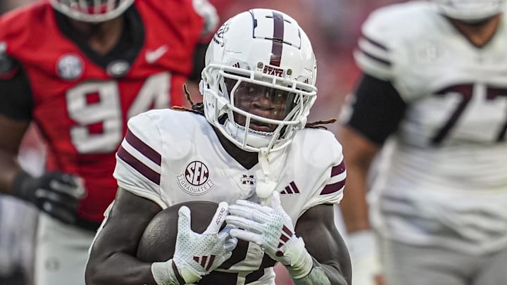 Mississippi State Bulldogs running back Davon Booth (21) runs the ball against the Georgia Bulldogs at Sanford Stadium.