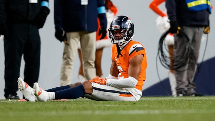 Dec 15, 2024; Denver, Colorado, USA; Denver Broncos cornerback Pat Surtain II (2) on the ground after a play in the fourth quarter against the Indianapolis Colts at Empower Field at Mile High. 