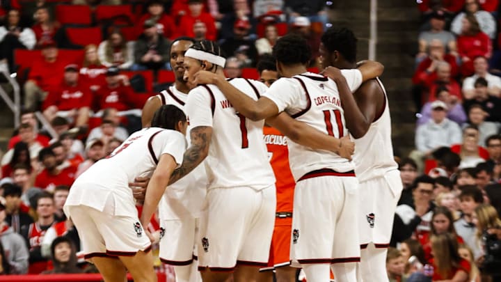Jan 27, 2026; Raleigh, North Carolina, USA; NC State Wolfpack players huddle during the second half of the game against the Syracuse Orange at Lenovo Center. Mandatory Credit: Jaylynn Nash-Imagn Images