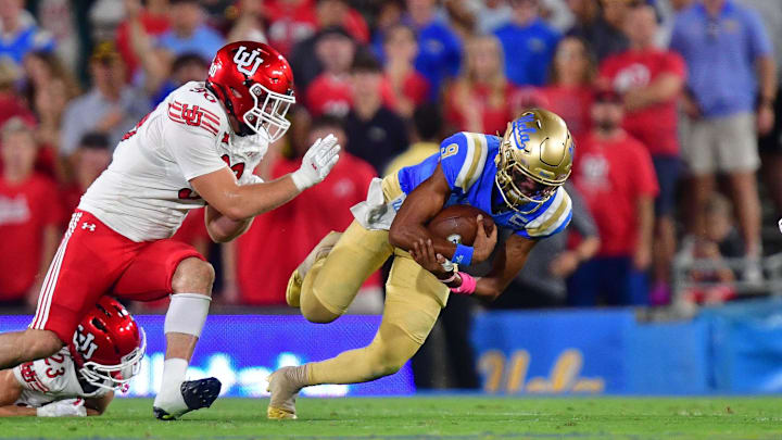 Aug 30, 2025; Pasadena, California, USA; Utah Utes defensive end John Henry Daley (90) and wide receiver Mana Carvalho (8) move in against UCLA Bruins quarterback Nico Iamaleava (9) during the first half at Rose Bowl. Mandatory Credit: Gary A. Vasquez-Imagn Images