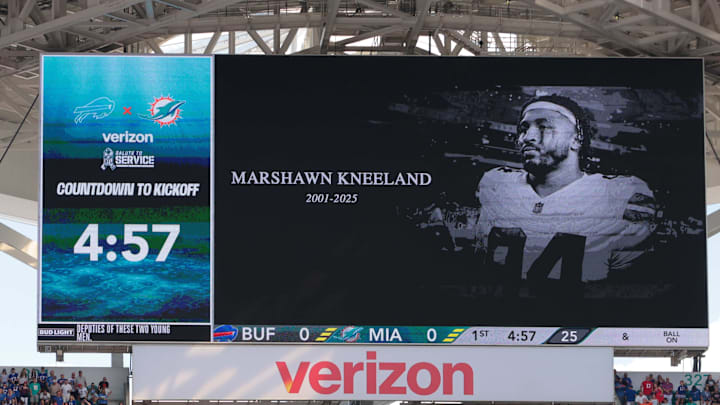 A moment of silence is held for Dallas Cowboys defensive end Marshawn Kneeland 