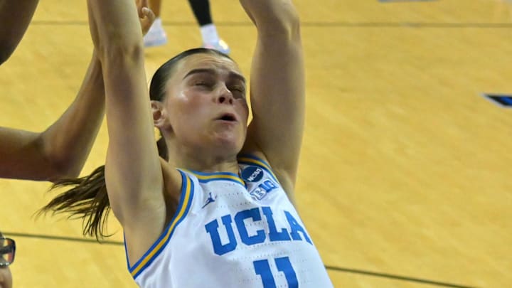 Mar 23, 2026; Los Angeles, CA, USA;  UCLA Bruins forward Gabriela Jaquez (11) and Oklahoma State Cowboys forward Praise Egharevba (24) reach for a rebound in the first half at Pauley Pavilion. Mandatory Credit: Jayne Kamin-Oncea-Imagn Images
