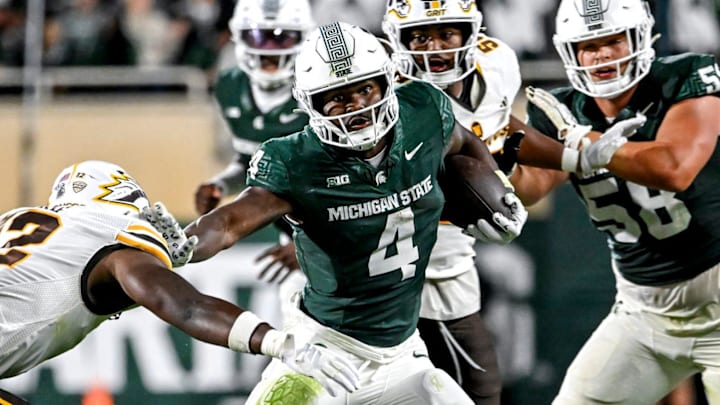 Michigan State's Elijah Tau-Tolliver runs for a gain against Western Michigan during the fourth quarter on Friday, Aug. 29, 2025, in East Lansing. Michigan State's Elijah Tau-Tolliver runs for a gain against Western Michigan during the fourth quarter on Friday, Aug. 29, 2025, in East Lansing.