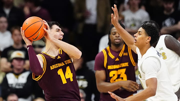 Feb 7, 2026; Boulder, Colorado, USA; Colorado Buffaloes guard Jalin Holland (11) defends on Arizona State Sun Devils forward Andrija Grbovic (14) in the second half at the CU Events Center. Mandatory Credit: Ron Chenoy-Imagn Images