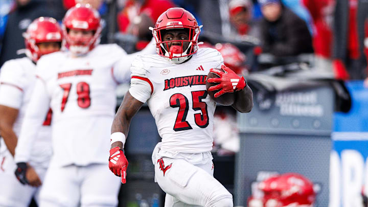 Nov 30, 2024; Lexington, Kentucky, USA; Louisville Cardinals running back Isaac Brown (25) runs the ball into the end zone for a touchdown during the fourth quarter against the Kentucky Wildcats at Kroger Field. Mandatory Credit: Jordan Prather-Imagn Images