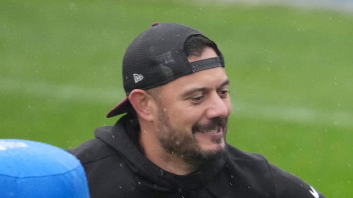 Washington Commanders quarterback Josh Johnson throws the ball against assistant quarterbacks coach David Blough. Washington Commanders quarterback Josh Johnson throws the ball against assistant quarterbacks coach David Blough.