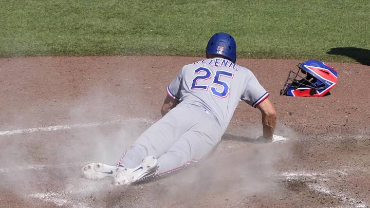 Jun 28, 2026; Toronto, Ontario, CAN; Texas Rangers pinch runner Jarred Kelenic (25) scores on a wild pitch against the Toronto Blue Jays during the ninth inning at Rogers Centre. Mandatory Credit: John E. Sokolowski-Imagn Images