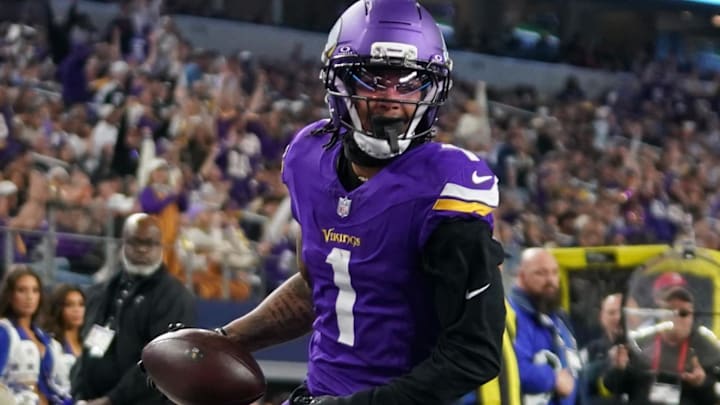 Dec 14, 2025; Arlington, Texas, USA; Minnesota Vikings wide receiver Jalen Nailor (1) makes a touchdown catch against Dallas Cowboys safety Donovan Wilson (6) during the second half at AT&T Stadium. Mandatory Credit: Raymond Carlin III-Imagn Images