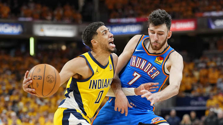 Jun 13, 2025; Indianapolis, Indiana, USA; Indiana Pacers guard Tyrese Haliburton (0) drives to the basket against Oklahoma City Thunder forward Chet Holmgren (7) during the second half during game four of the 2025 NBA Finals at Gainbridge Fieldhouse. Mandatory Credit: Kyle Terada-Imagn Images