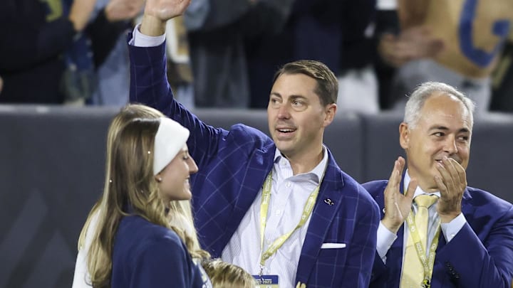 Oct 20, 2022; Atlanta, Georgia, USA; Georgia Tech Yellow Jackets athletic director J Batt is introduced on the field as president Angel Cabrera against the Virginia Cavaliers in the first half at Bobby Dodd Stadium. Mandatory Credit: Brett Davis-Imagn Images