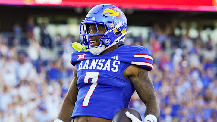 Aug 23, 2025; Lawrence, Kansas, USA; Kansas Jayhawks wide receiver Cam Pickett (7) scores a touchdown during the first half against the Fresno State Bulldogs at David Booth Kansas Memorial Stadium. Mandatory Credit: Jay Biggerstaff-Imagn Images